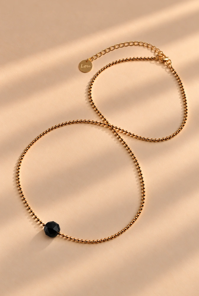 Nelis – collana in ematite con pietra di onice
